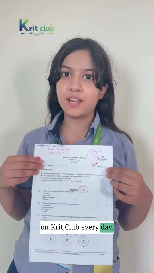 Krit Club student showing her 19.5/20 Science mark sheet